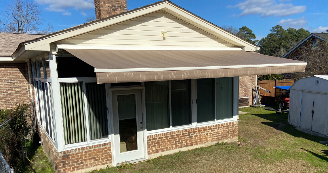 Retractable awning on back of house