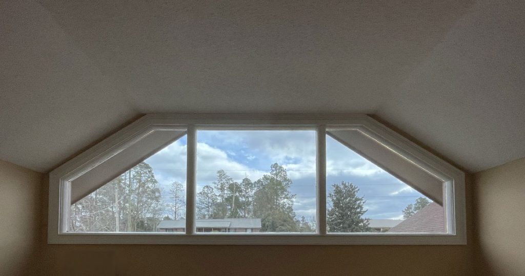 Large bay window, with window treatment to allow the perfect amount of light and heat.